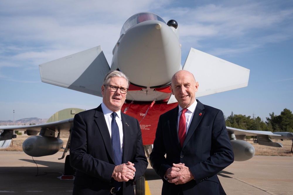 Keir Starmer and former defence secretary John Healey, who resigned on Thursday over military funding decisions (PA)