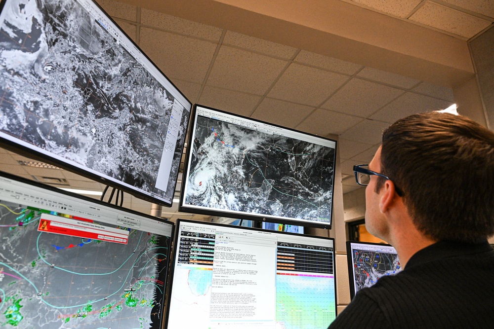 NOAA meteorologist Aidan Mahoney works at the National Hurricane Center in Miami, Florida, in May 2025. Scientists are still using traditional forecasting methods alongside AI models (AFP via Getty Images)