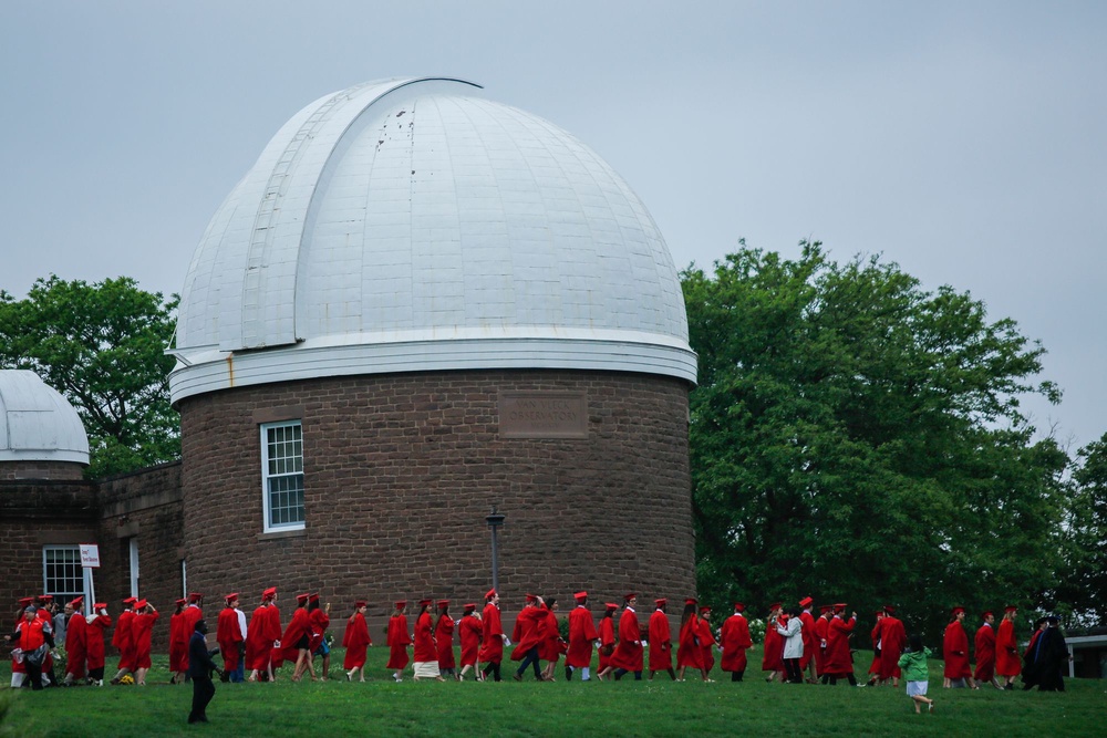A spokesperson for Wesleyan University, where the cost of attendance exceeds $100,000 for the coming academic year, said the school 'commits to meeting students’ demonstrated financial need and, on average, students receive grants totaling $69,744.' Pictured here, students arrive to attend the commencement ceremony on May 27, 2018 at the Connecticut school (Getty Images)