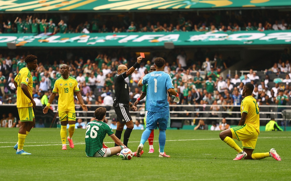 South Africa's Sphephelo Sithole is sent off after denying a goalscoring opportunity (Reuters)