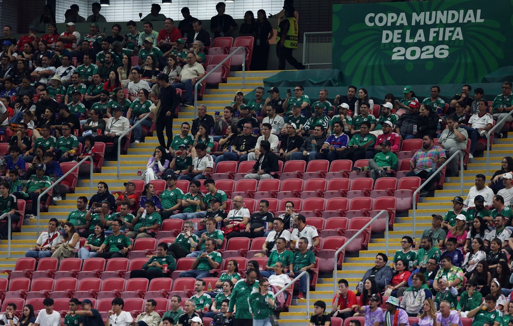 Empty seats are seen in the stands during the match (Reuters)