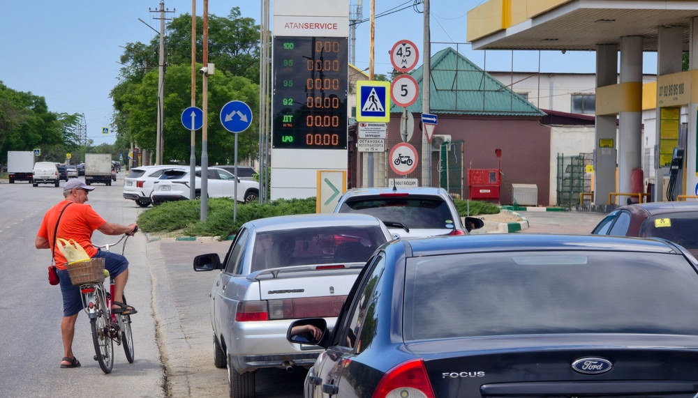 Cars queue to refuel at a gas station after local authorities restricted petrol sales in the Black Sea resort city of Yevpatoriya (Reuters)