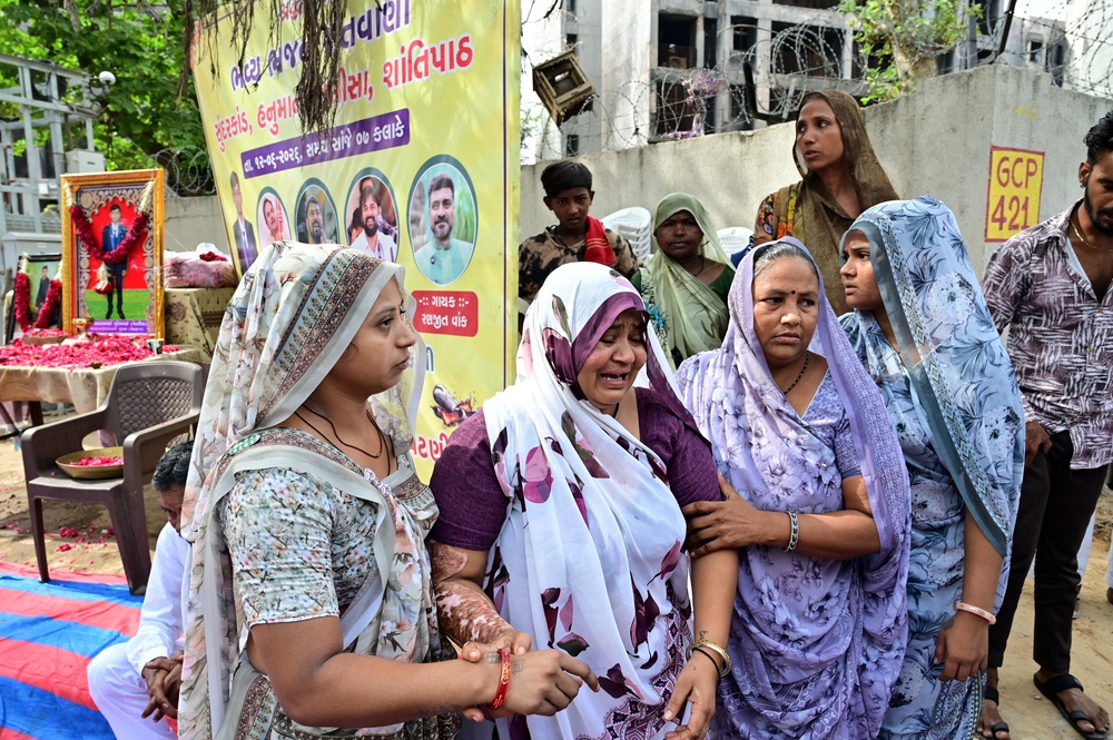 Akash Patni, mother of an Air India crash victim, grieves at the accident site on the first anniversary of the disaster in Ahmedabad on 12 June 2026 (AFP/Getty)