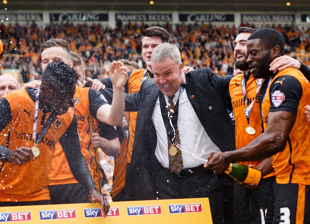 Wolverhampton Wanderers' manager Kenny Jackett celebrates their promotion as champions (PA)