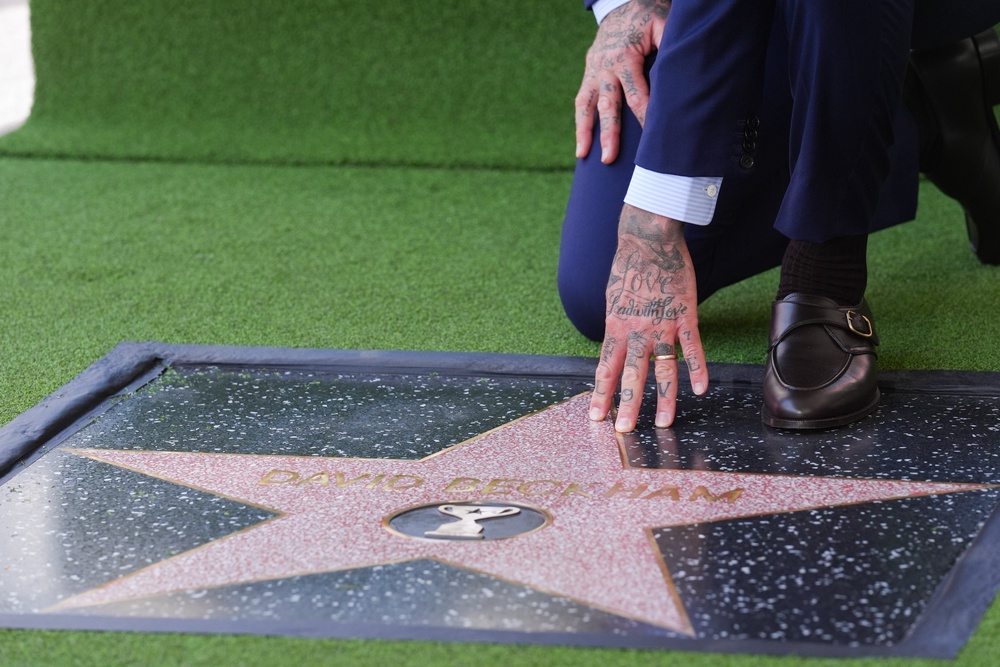 Beckham touches his Walk of Fame star (AP)