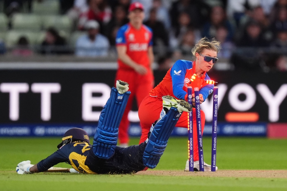 England's Charlie Dean attempts a run-out on Sri Lanka's Kavisha Dilhari (PA)