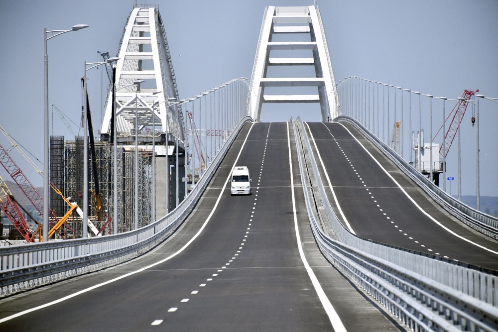 A vehicle runs down the 19 km road-and-rail Crimean Bridge passing over the Kerch Strait and linking southern Russia to the Crimean peninsula (AFP/Getty)