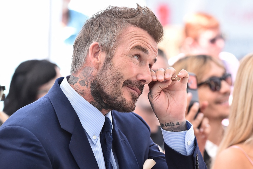 Sir David Beckham was banned from driving for six months for using his mobile phone at the wheel in 2019 (AFP/Getty)
