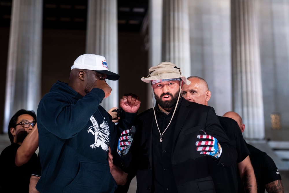 Derrick Lewis facing off with Hokit at Friday’s press conference (Getty)