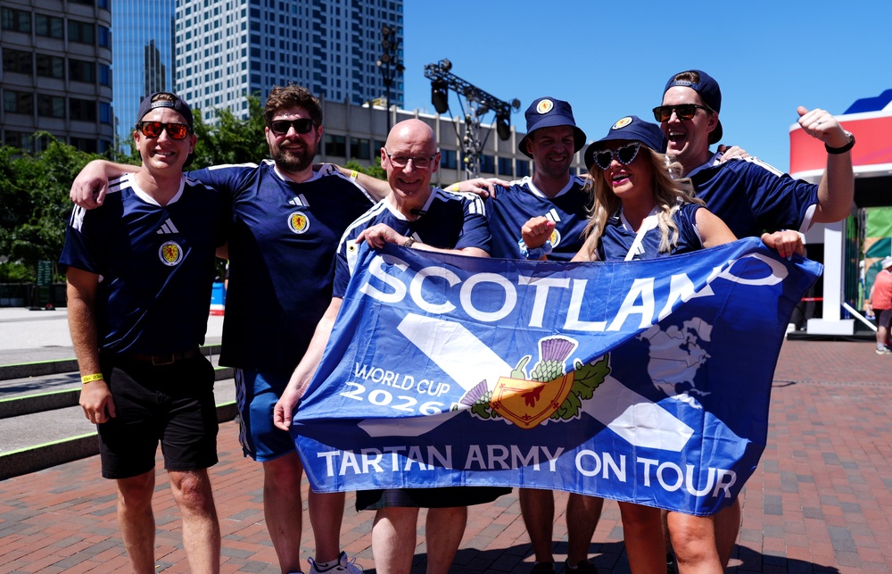 Scottish First Minister John Swinney (third left) with a Scotland fans at the FIFA Fan Festival ahead of the FIFA World Cup (PA)