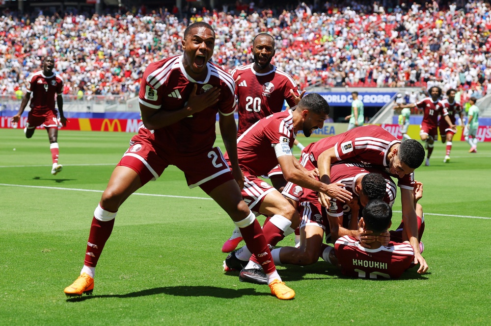 Qatar celebrate their late equaliser against Switzerland (Reuters)