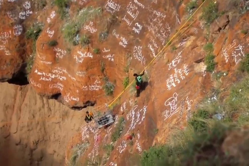 Al-Qaqa Ibn Antar has gone viral in recent years for his daring climbs (AP)