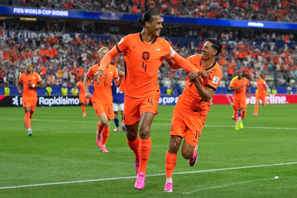 Netherlands' Virgil van Dijk (4) celebrates scoring his side's first goal against Japan (AP)