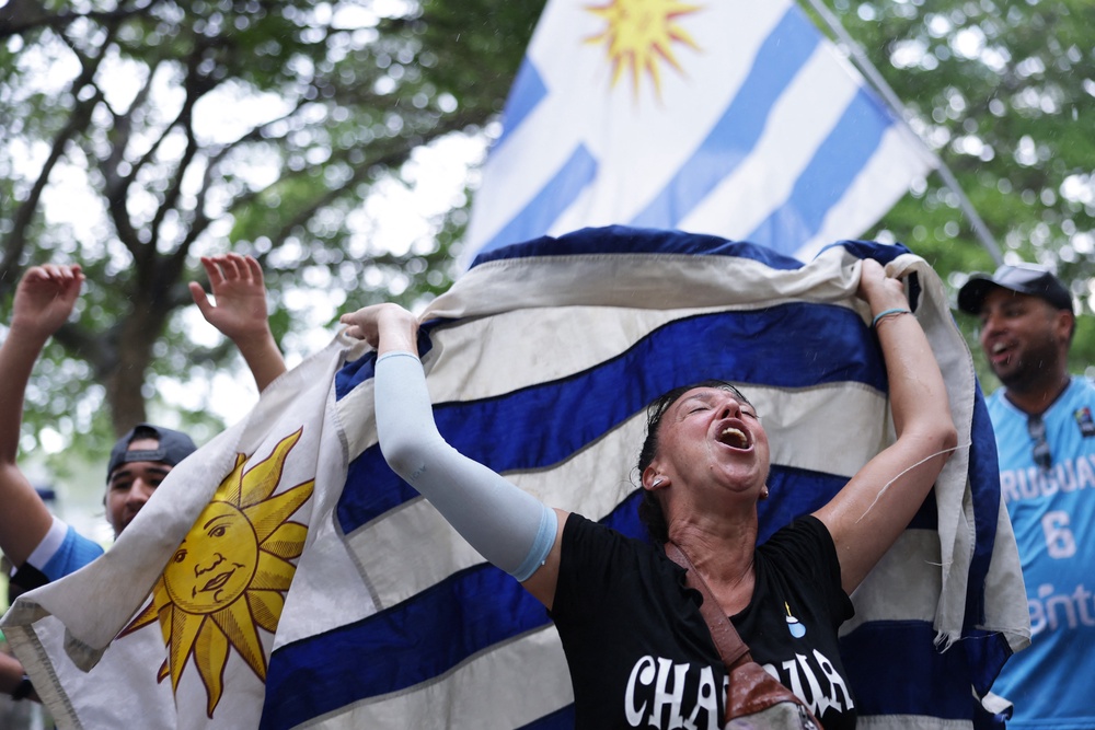 Uruguay fans gather in Miami Tropical Park, Florida (Reuters)