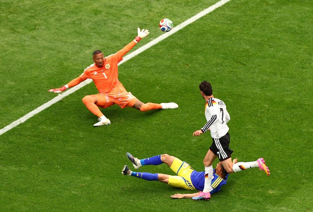 Havertz dinks a finish past Curacao goalkeeper Eloy Room (Reuters)