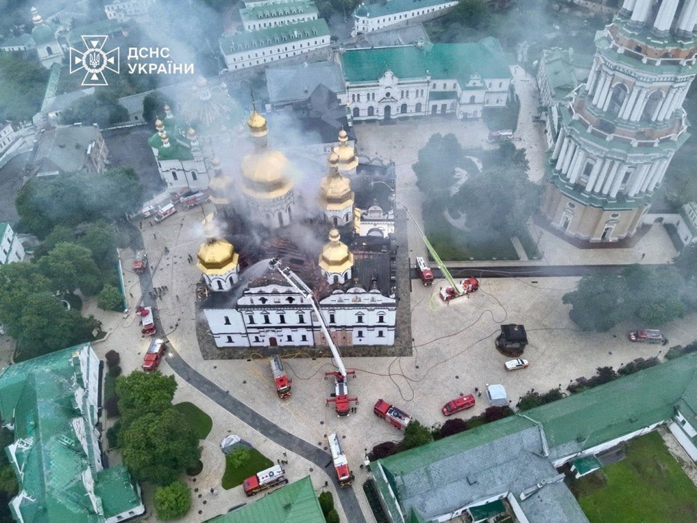 A drone view shows firefighters as they work to extinguish a fire at the Dormition Cathedral of the Kyiv Pechersk Lavra (Reuters)