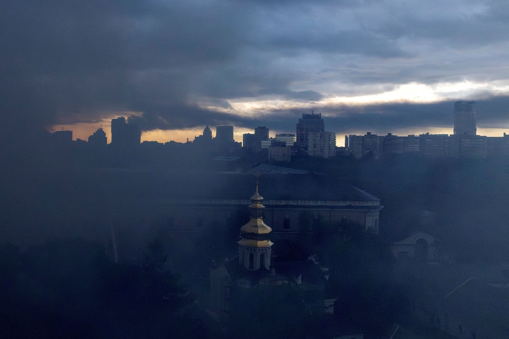 Smoke rises over a church of the Kyiv Pechersk Lavra after a night of Russian missile and drone strikes (Reuters)