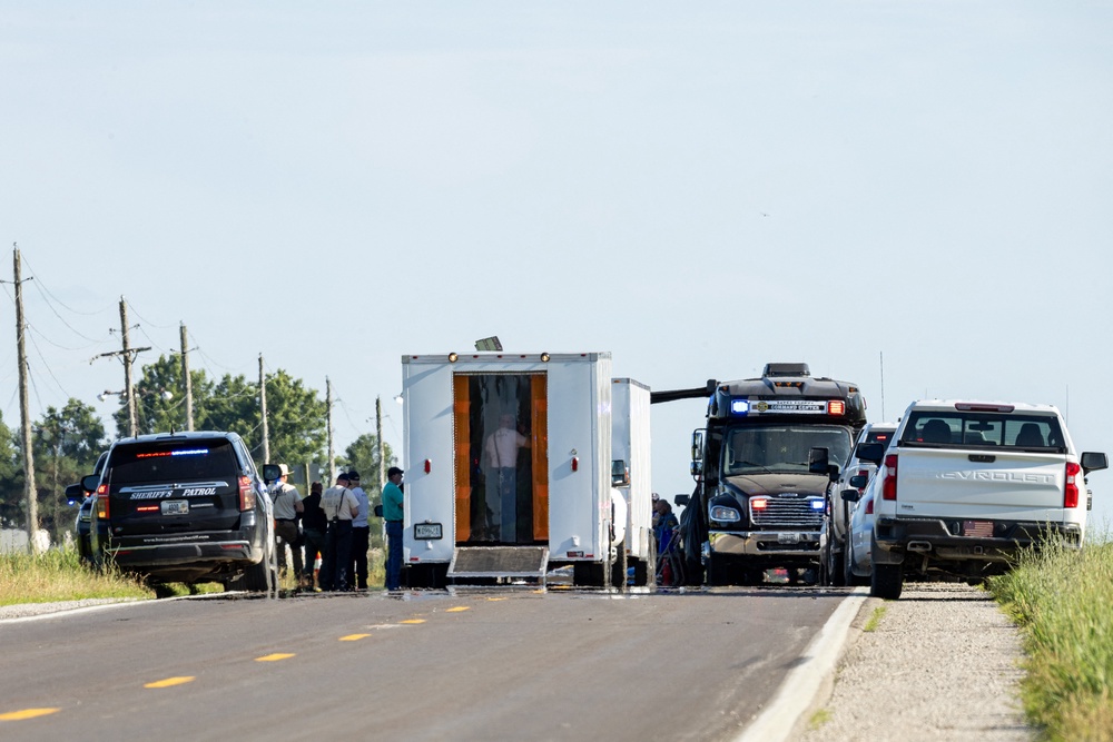 Bates County Command Center vehicles block the road near the scene of a fatal skydiving plane crash near Butler Memorial Airport (AFP/Getty)