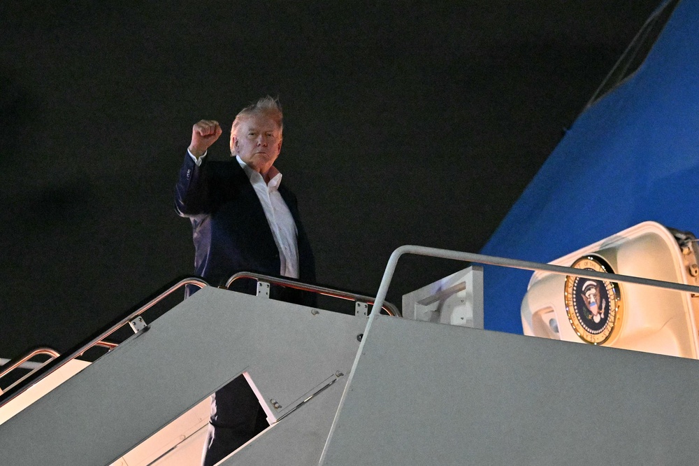 Donald Trump boards Air Force One before departing Joint Base Andrews in Maryland to fly to Evian-les-Bains, France, for the G7 summit on June 15 (AFP/Getty)