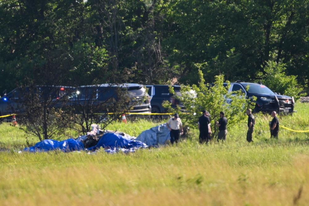The single-engine turboprop aircraft crashed shortly after takeoff from Butler Memorial Airport, about an hour south of Kansas City. Authorities said all 12 people aboard were killed as family members watched from the ground (AP)