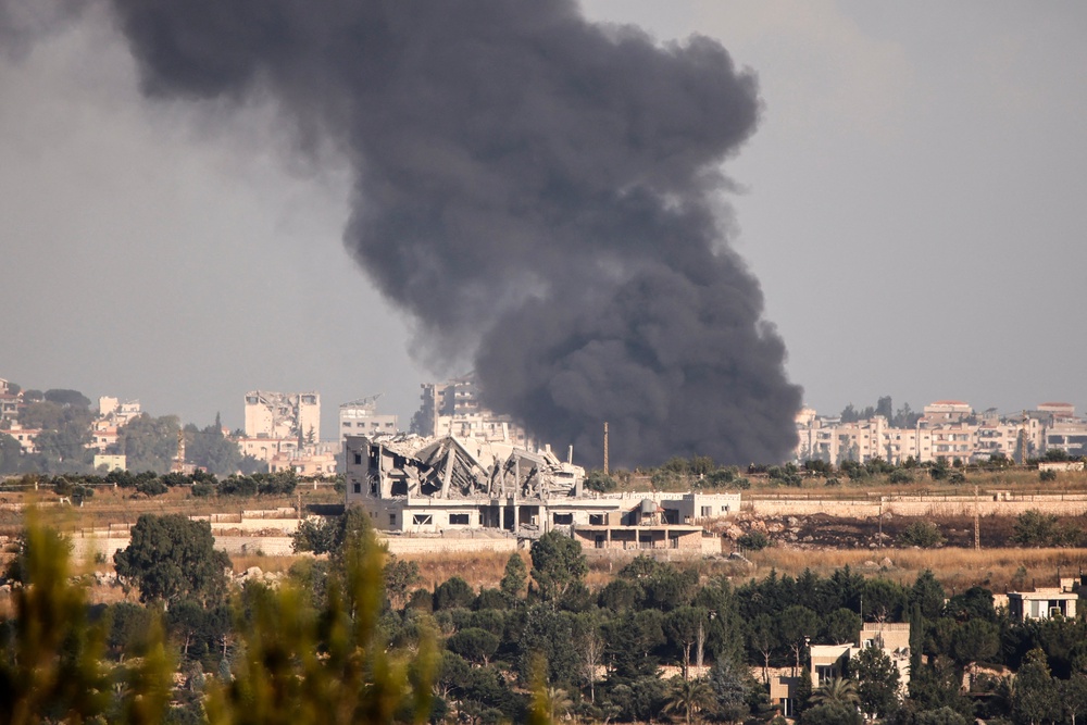 Smoke billows from fires reportedly ignited at a site targeted by Israeli shelling in Kfar Tebnit, Lebanon, on 15 June (AFP/Getty)