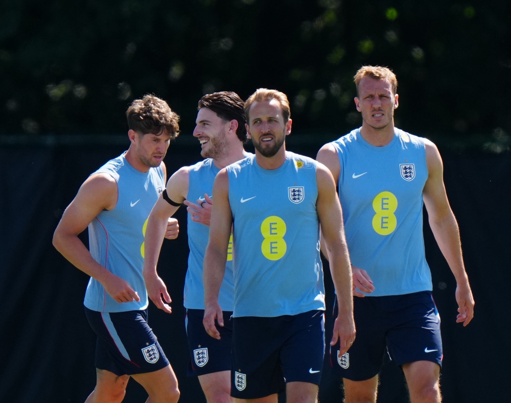 Harry Kane leads his teammates in training (PA)