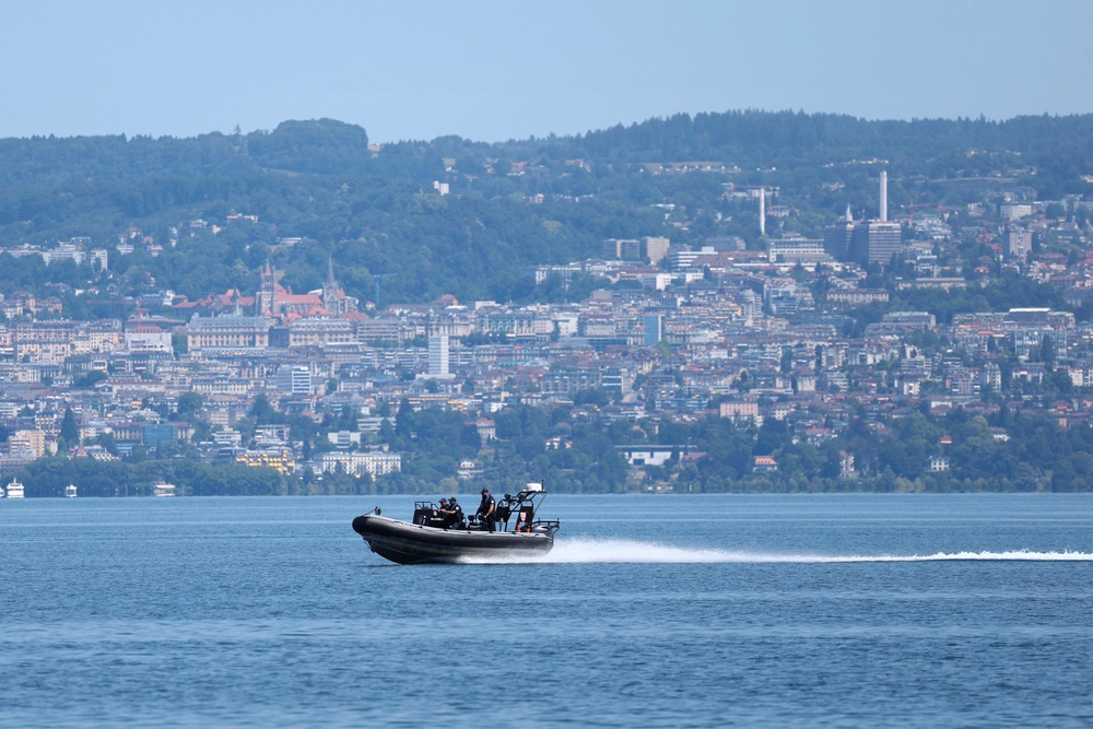 A French police boat patrols on Lake Geneva in front of the Swiss city of Lausanne on the opening day of the G7 summit in Evian-les-Bains, France (Reuters)