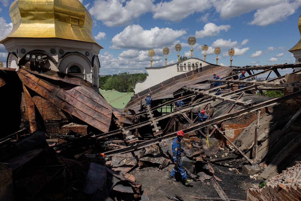 Ukrainian firefighters work at the roof of the damaged Dormition Cathedral in the Orthodox complex of the Kyiv Pechersk Lavra following a Russian missile and drone strike in Kyiv on June 15, 2026, amid the Russian invasion of Ukraine (AFP/Getty)