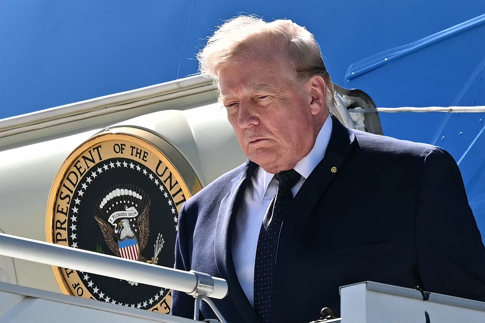 Donald Trump disembarks Air force One after landing at the Geneva airport ahead of the G7 summit, in Geneva on June 15 (AFP/Getty)