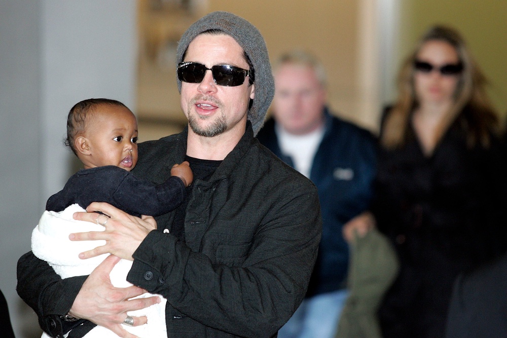 Brad Pitt pictured in 2005 holding his daughter Zahara Marley Jolie, who recently filed to drop ‘Pitt’ from her double-barrelled last name (Getty Images)