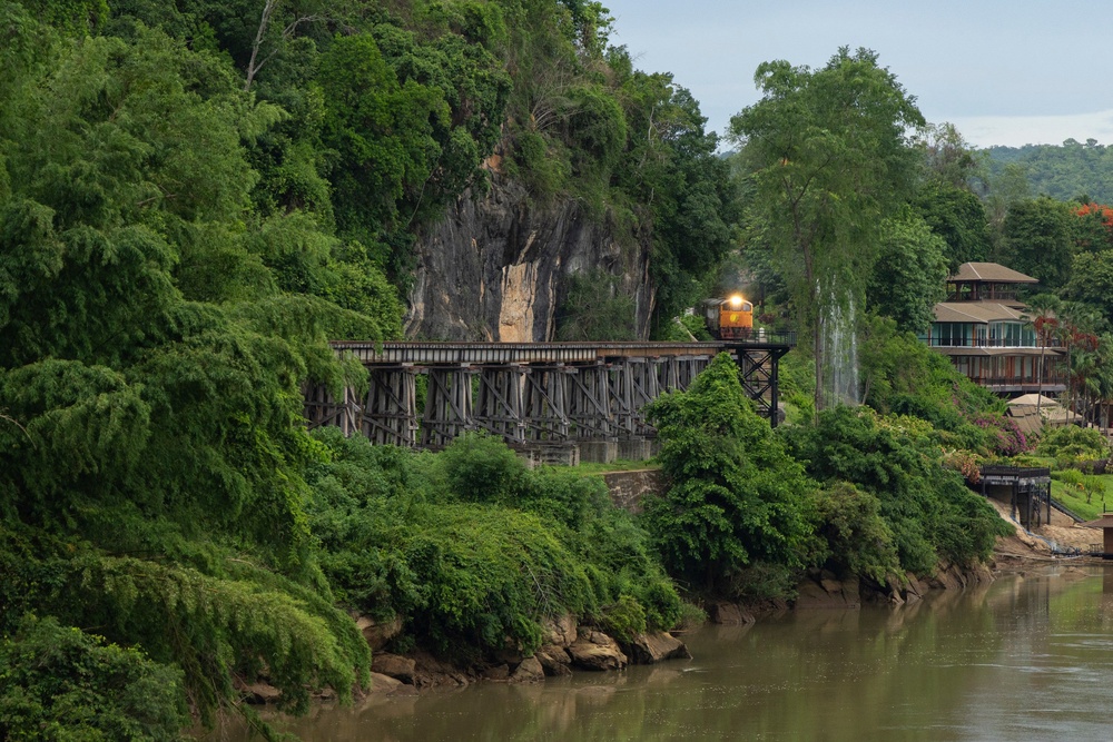 A train approaches Thamkra Sae Station, one of the still active sections of the ‘Death Railway’, in Sai Yo (AP)