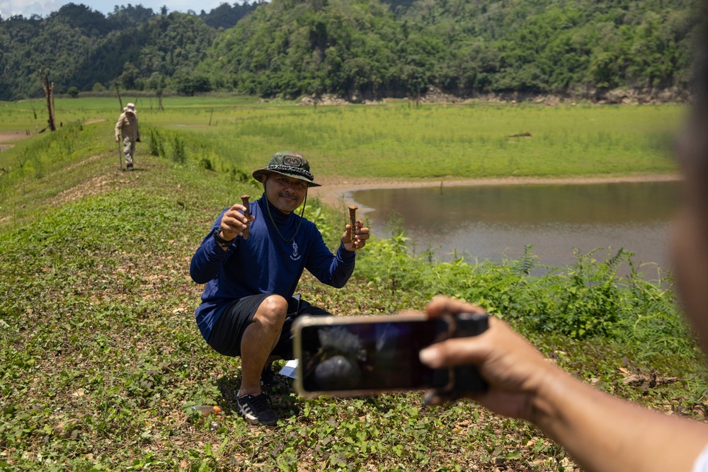 Local residents take pictures of artefacts from Nithe Station (AP)