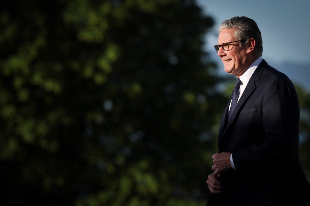 PM Keir Starmer walks during the official greeting as part of the G7 summit in Evian in eastern France (AFP/Getty)