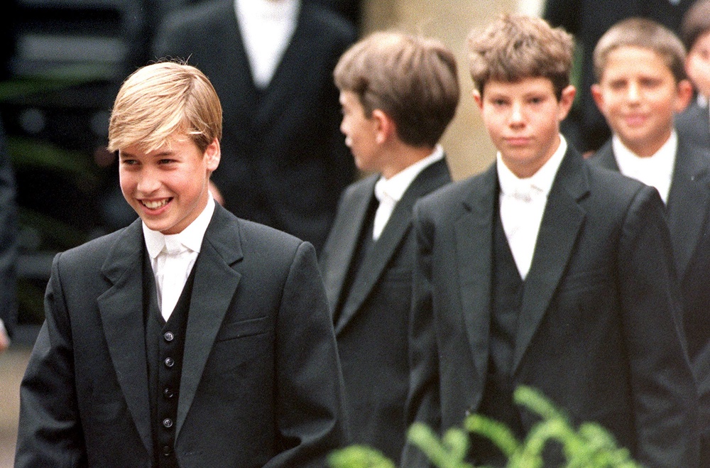 Prince William (now the Prince of Wales) leads his classmates to lessons on his first day at Eton School (PA)