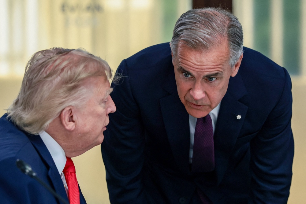 US President Donald Trump (L) and Canada's Prime Minister Mark Carney (R) attend a work lunch as part of the G7 summit, in Evian, eastern France, on June 16, 2026. (AFP/Getty)