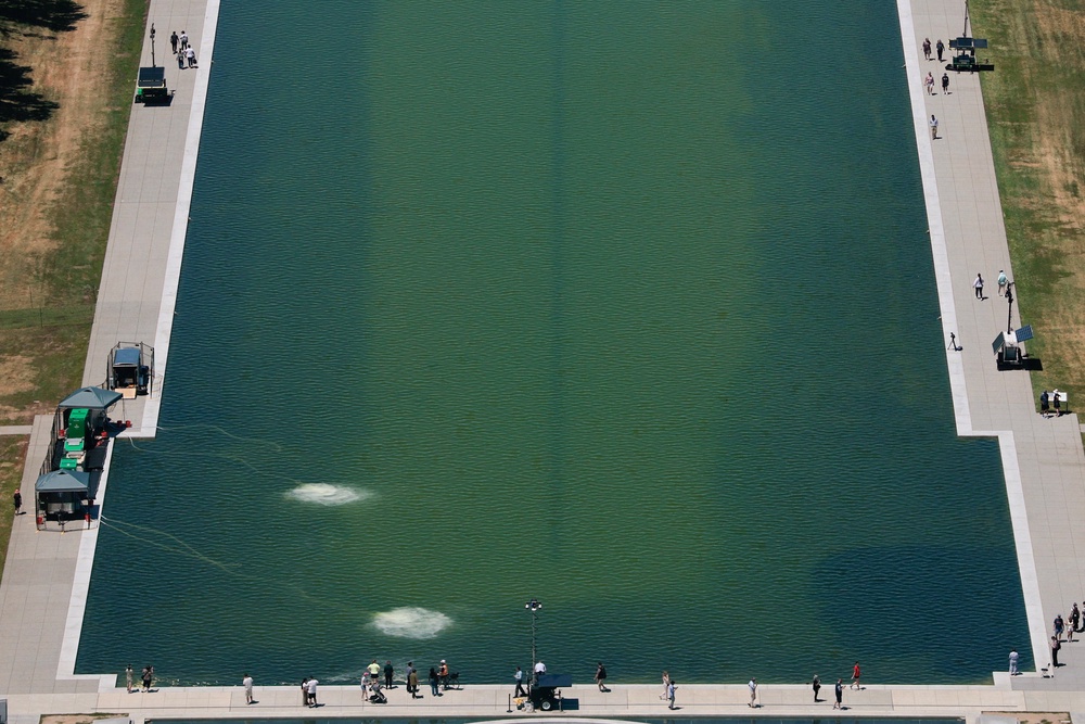 A view of the greenish Lincoln Memorial Reflecting Pool after recent renovations following a directive from U.S President Donald Trump to paint it blue (Reuters)