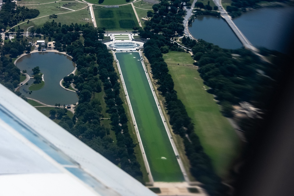 Just days after Trump's $14 million refurbishment was completed, the Reflecting Pool became overgrown with algae (AP)