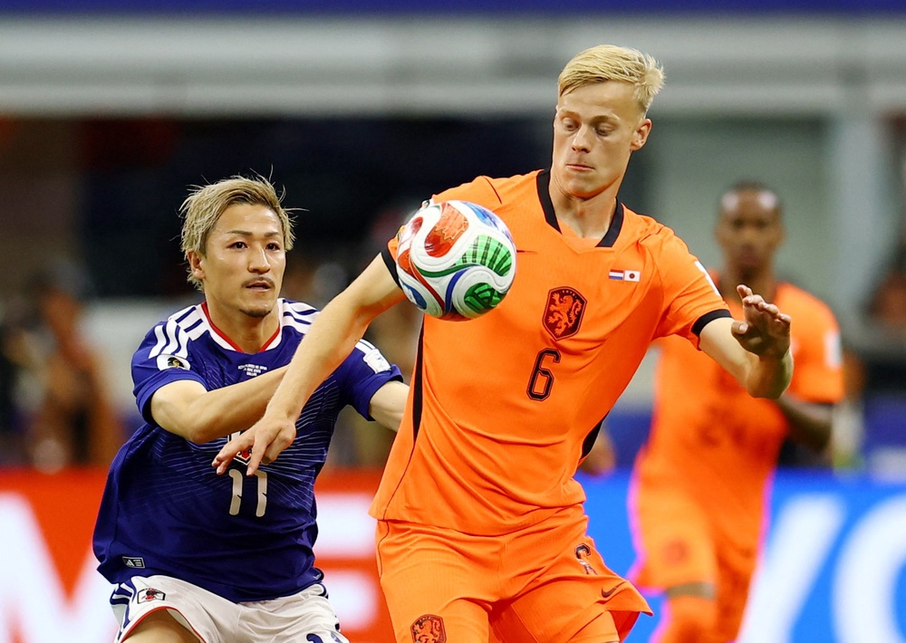 Jan Paul van Hecke in action against Japan (Reuters)