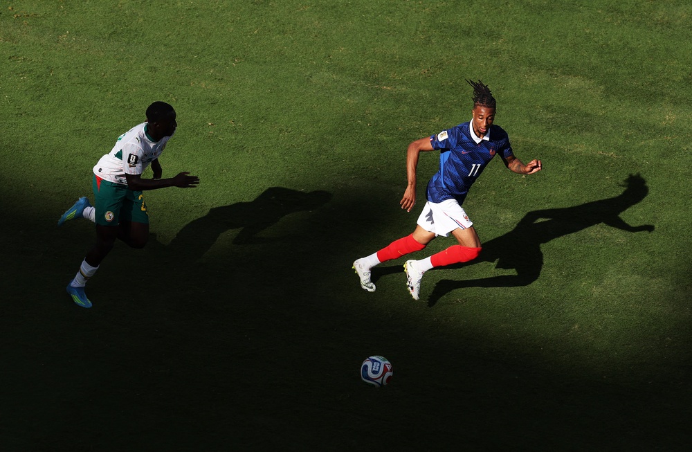 Michael Olise #11 of France chases after a loose ball (Getty)