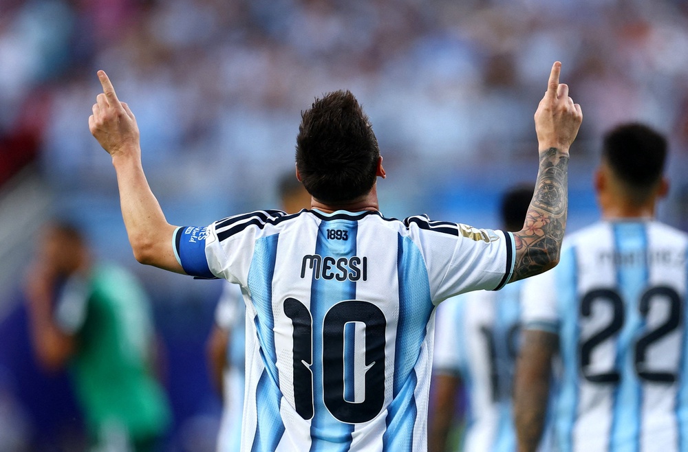 Argentina's Lionel Messi celebrates scoring their first goal (Reuters)