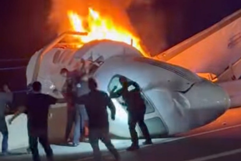 Crews rushed to pull out people from a small plane Tuesday night that crashed in the middle of a highway in southern Texas, as flames burst from the aircraft (Zayra Garza)