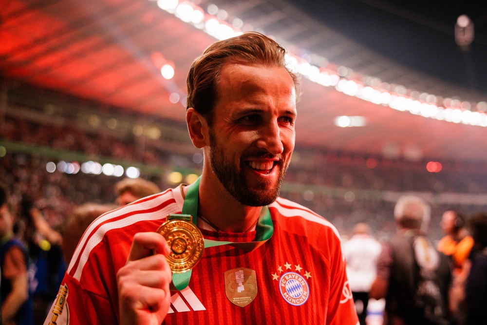 Kane shows off his medal after the DFB Cup final (Getty)