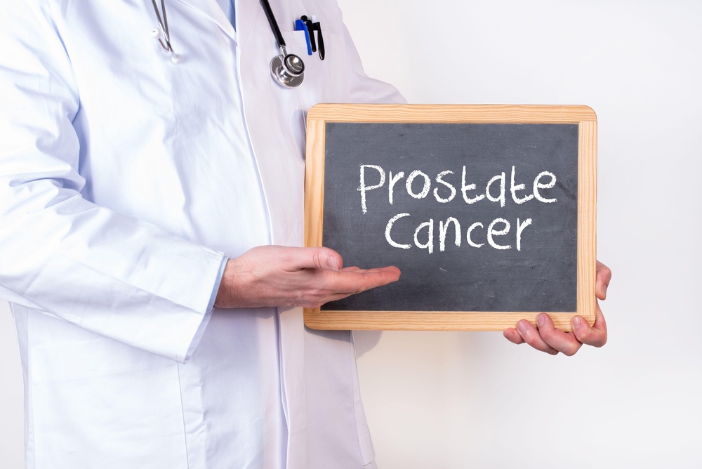 Doctor holding blackboard with ”Prostate Cancer” written on it (Alamy/PA)
