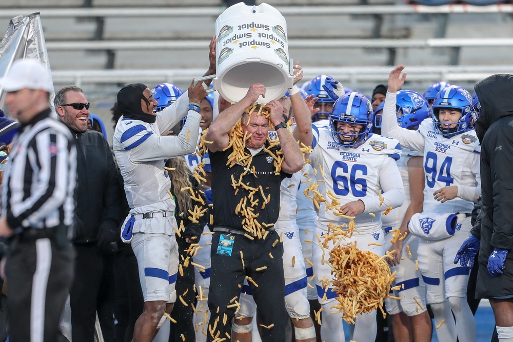 Georgia State University Head Coach Shawn Elliot is showered by French fries during the Famous Idaho Potato Bowl in Boise, Idaho, in December 2023. Frying potatoes produces a carcinogen, known as acrylamide (Getty Images)
