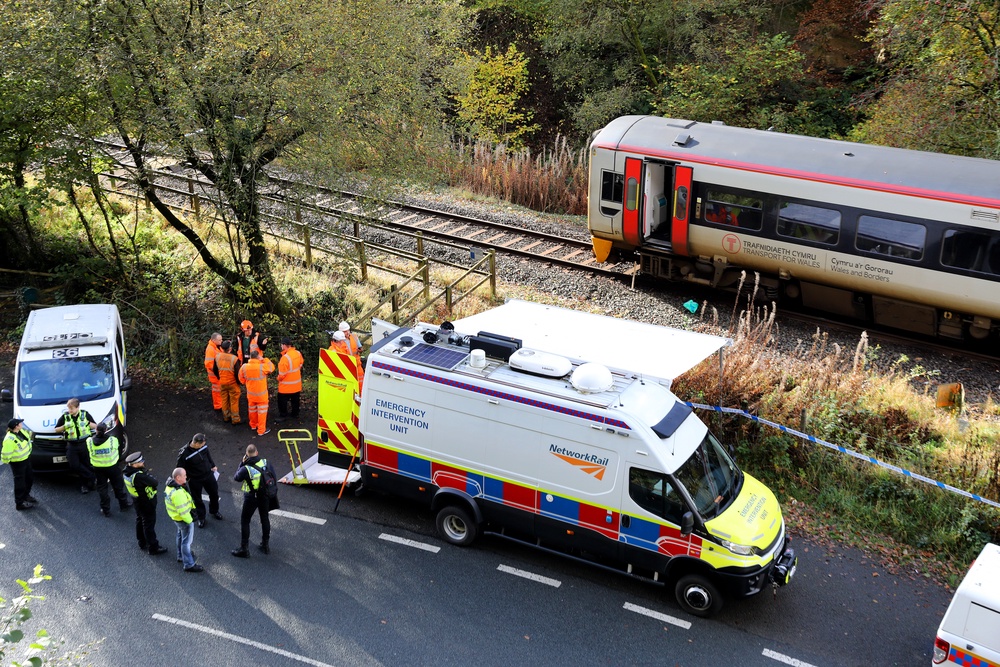 Emergency workers at the scene after the collision involving two trains near Llanbrynmair, mid Wales (Ian Cooper/PA) (PA Archive)