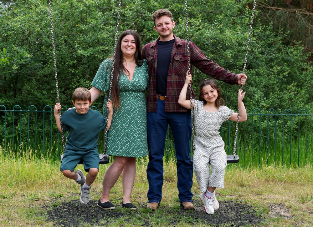 Tom Atkins and Amy Govier with their children Elliot, seven, and Miya, nine (PA)