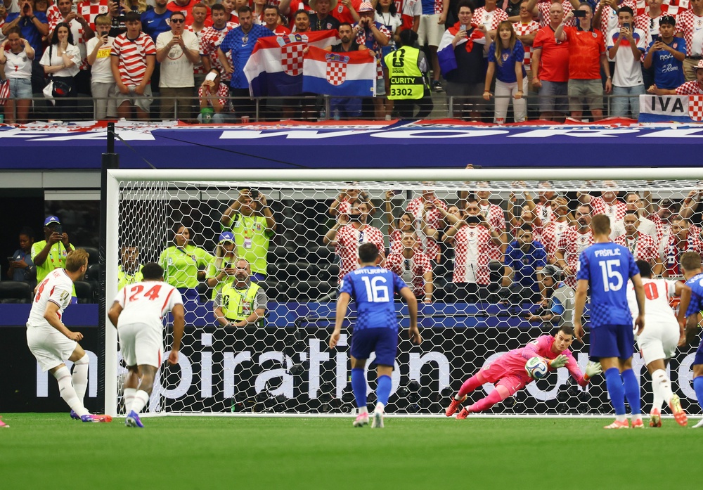 Dominik Livakovic saved Kane's first attempt before the England captain scored the second (Reuters)