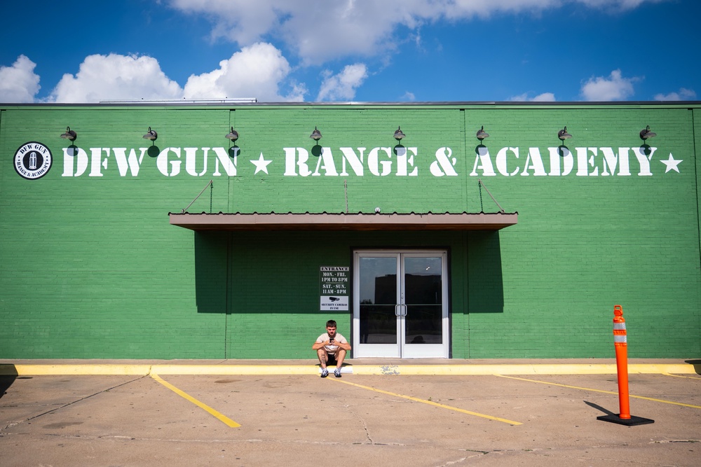 An England fan sits outside the DFW Gun Range and Academy in Dallas (PA)