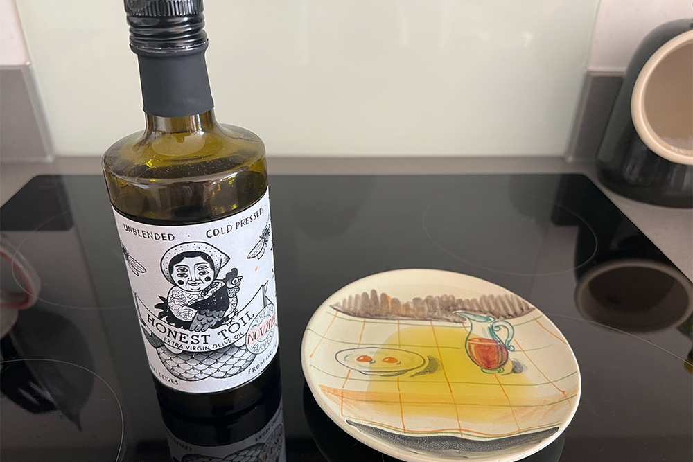 This raw, unfiltered olive oil is slightly opaque due to sediment from the olive skins and pips (Kate Ng/The Independent)
