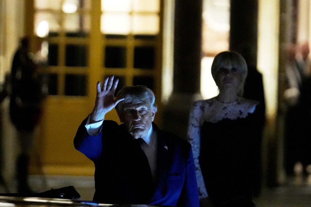Donald Trump departs after the dinner at the Palace of Versailles, early Thursday (Reuters)